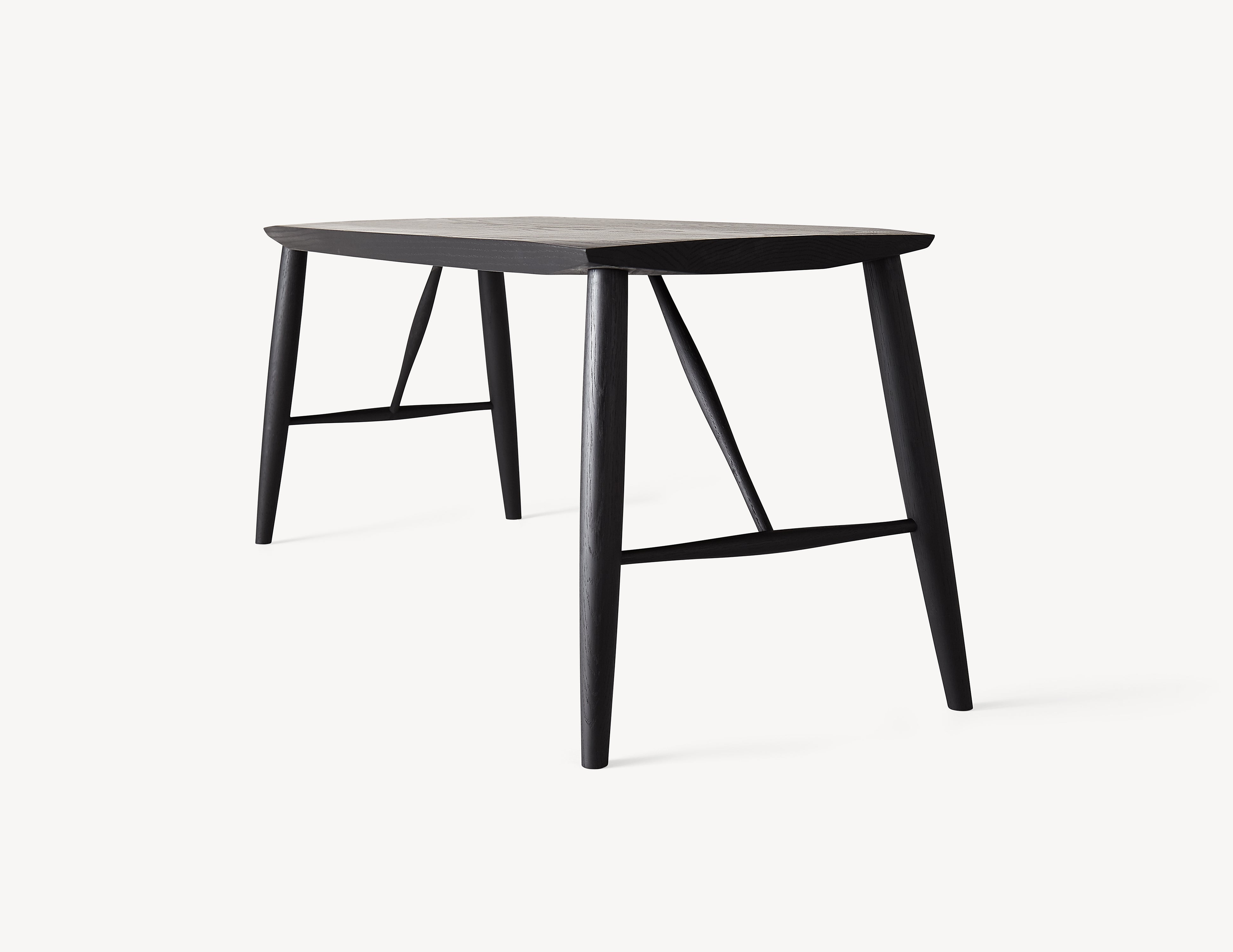 minimal black bench with spindles in dark wood. three quarter view
