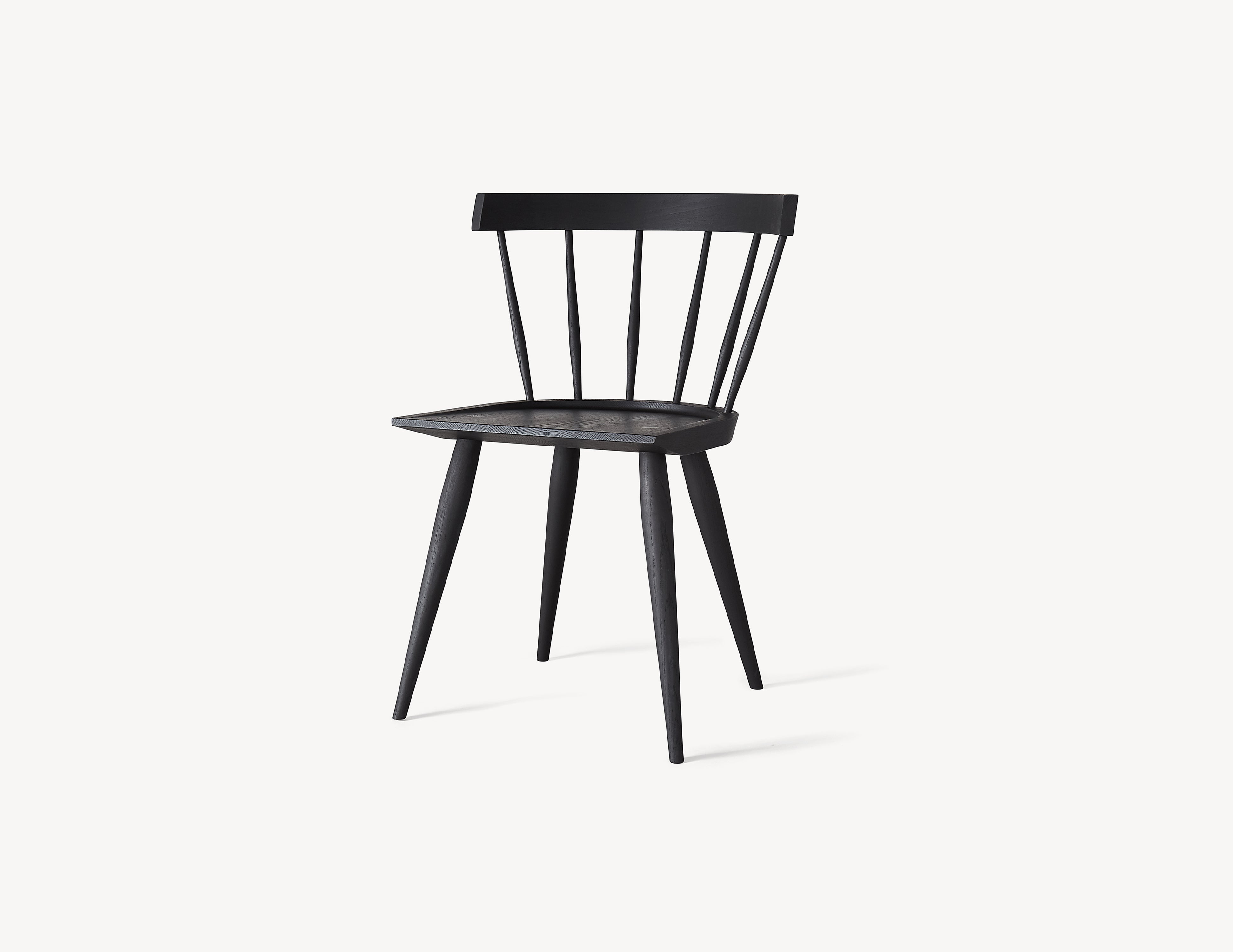 minimal black wooden windsor dining chair in dark stained wood.
