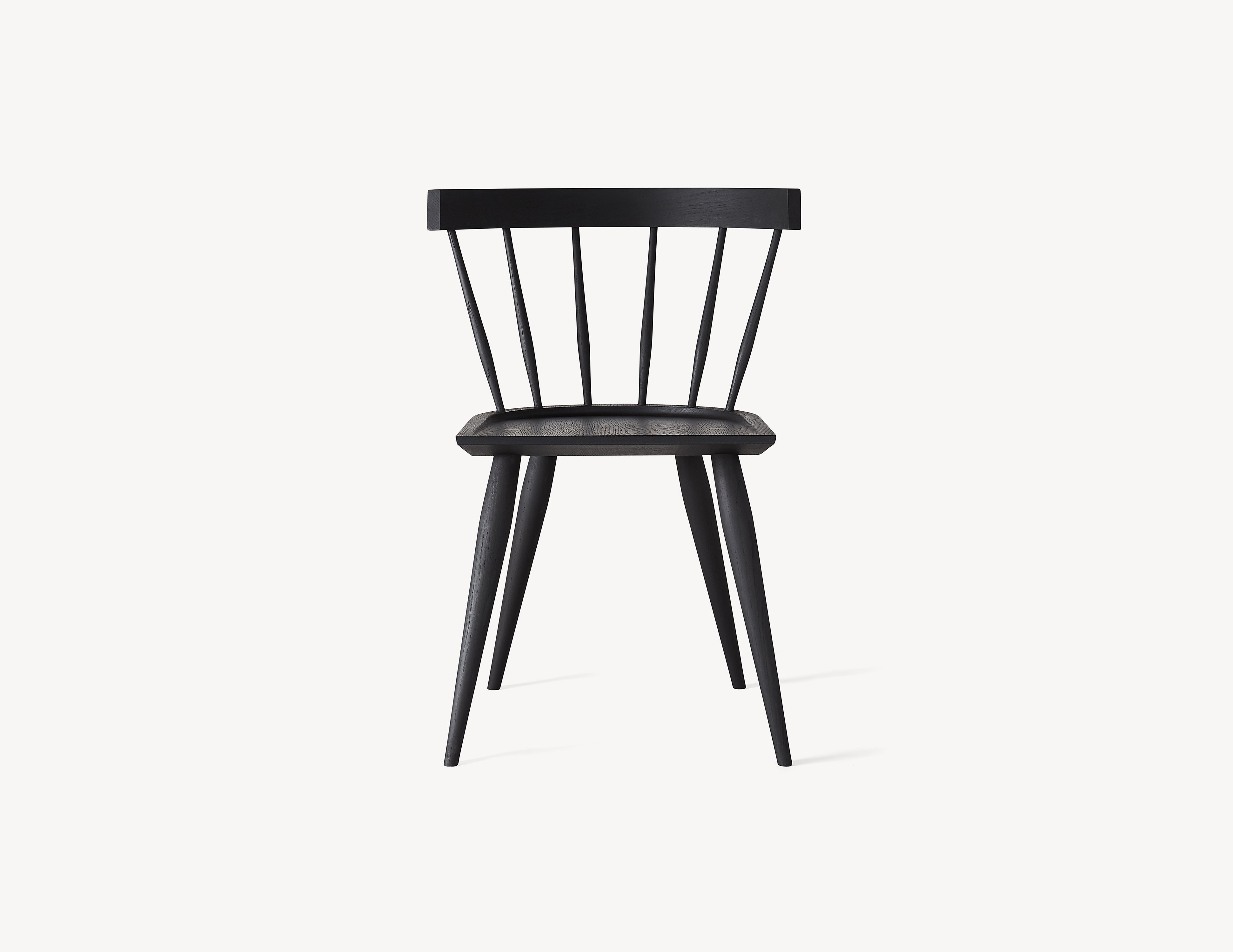 minimal black wooden windsor dining chair in dark stained wood.