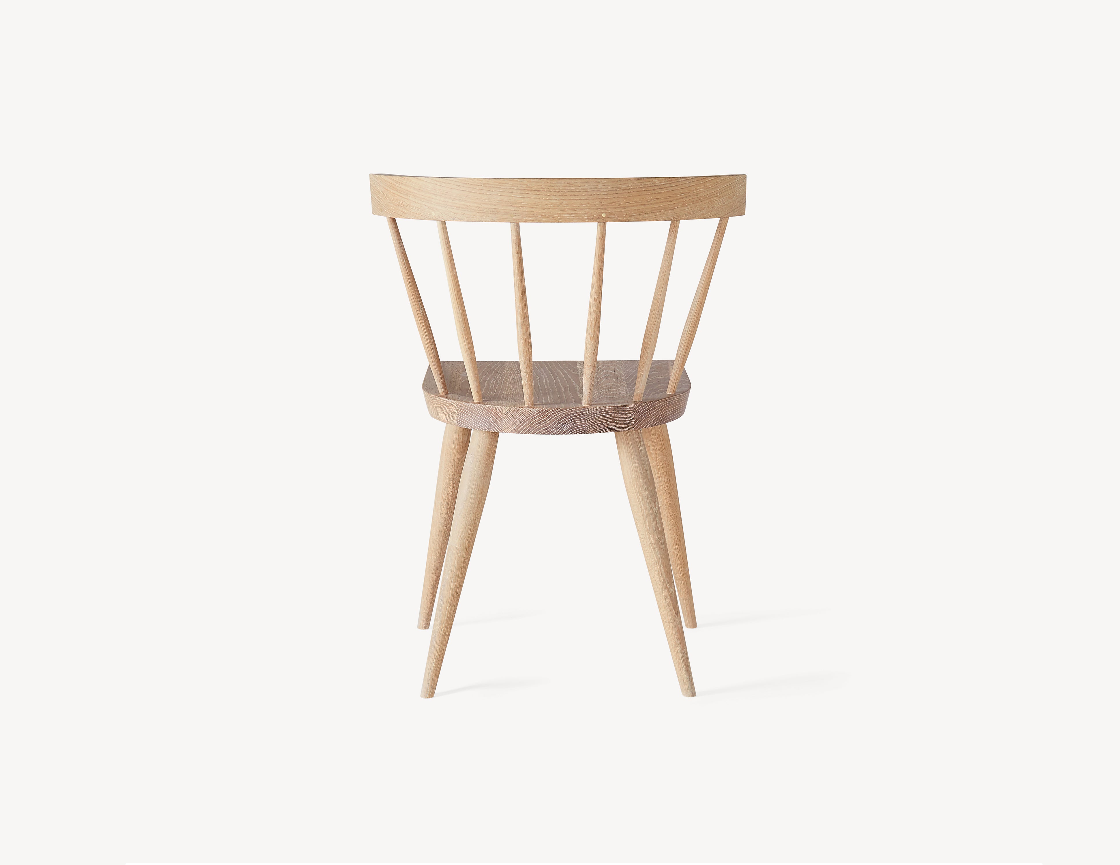 rear view of minimal white oak windsor dining chair.
