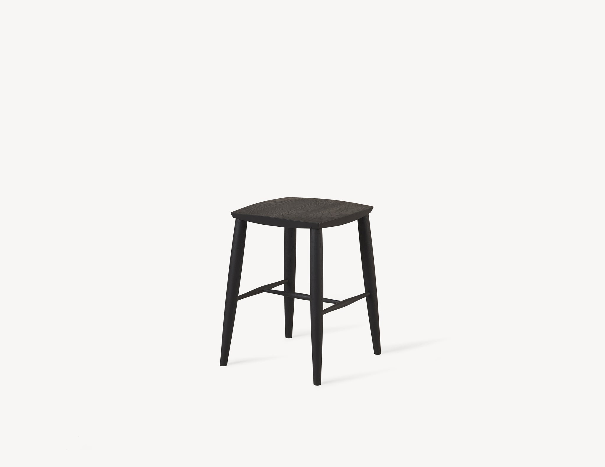 short minimal wooden stool in black oak wood.