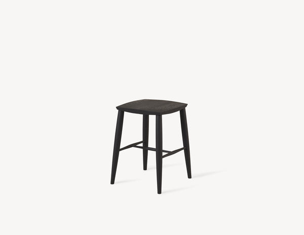 short minimal wooden stool in black oak wood.