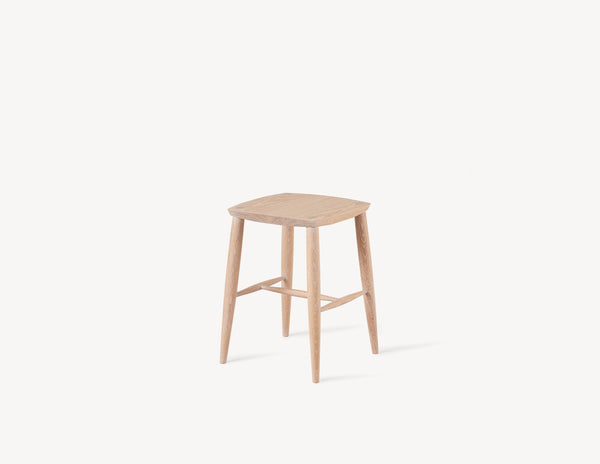 short minimal wooden stool in light oak wood.