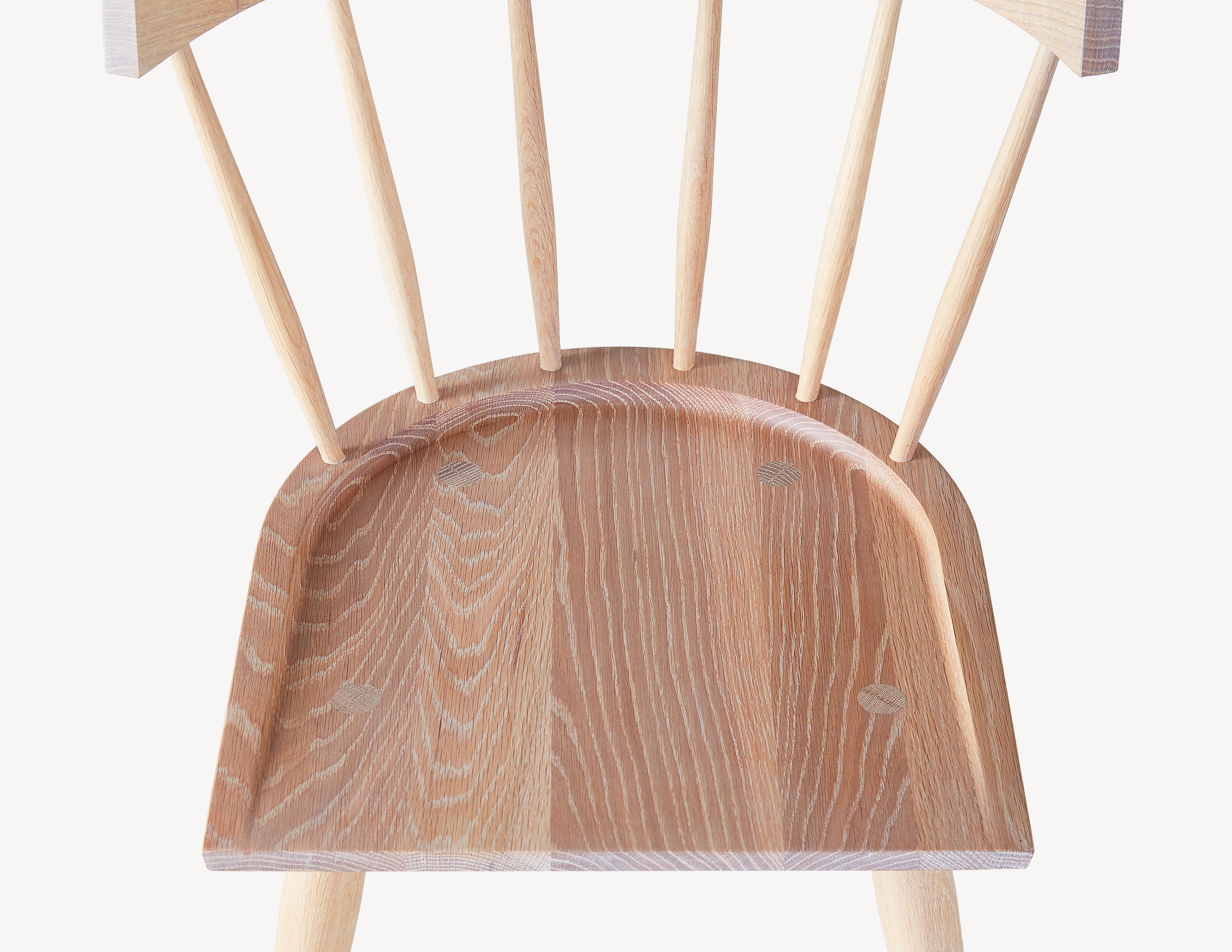 top view of light wood windsor dining chair.