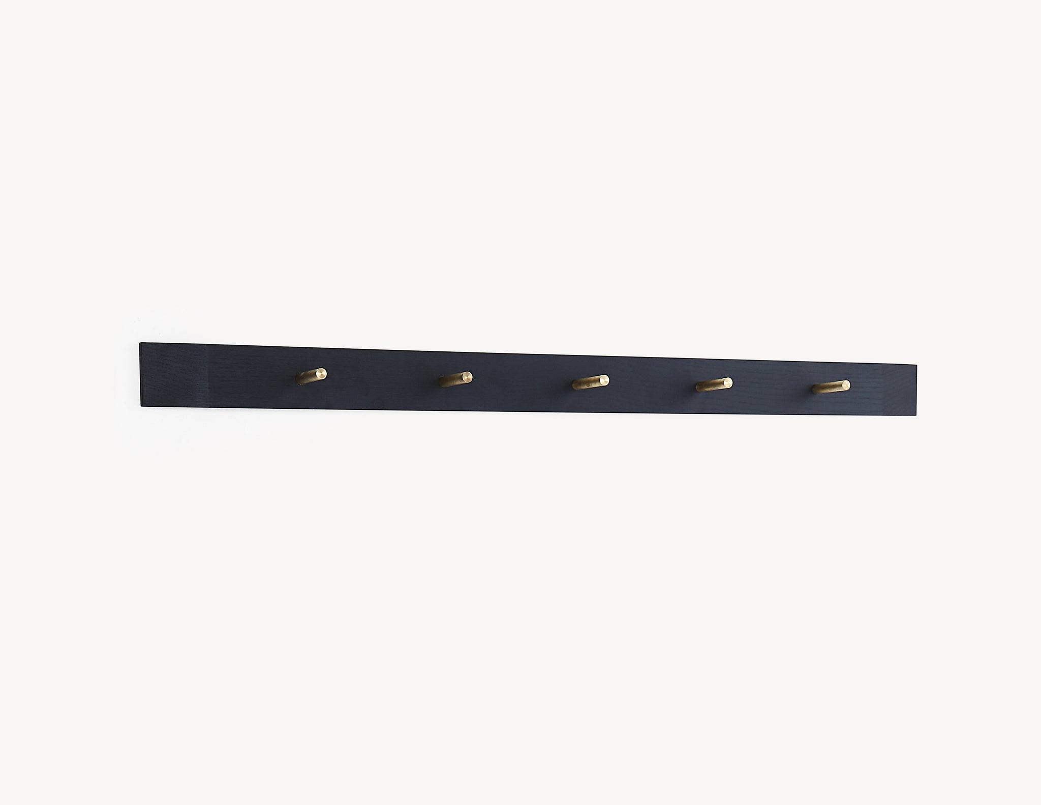 black wooden rail in dark stained wood, with brass pegs.