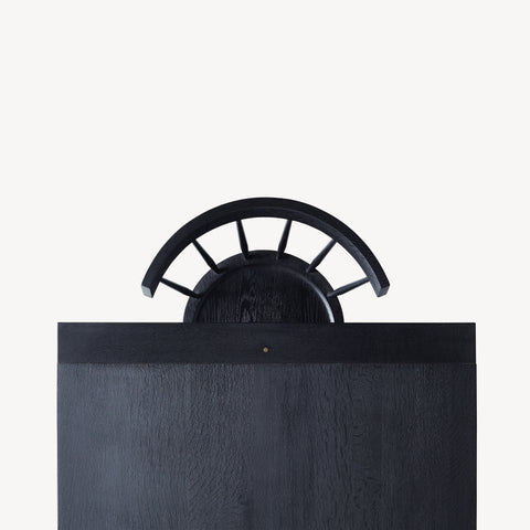 top view of black dining table with a black chair.