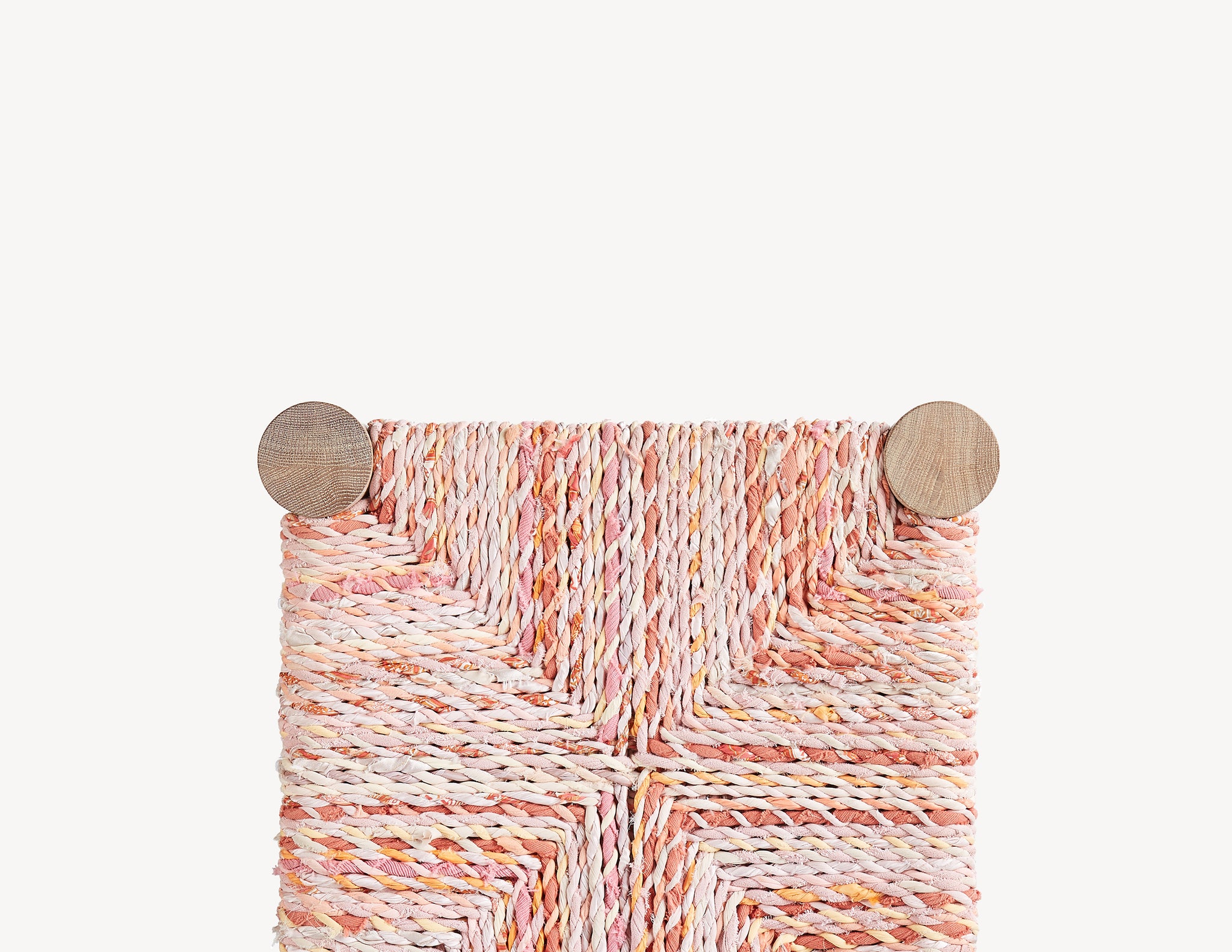 wooden stool with pink woven seat.  top view.